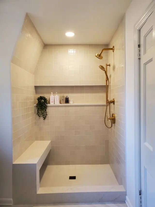 After: walk-in tile shower with bench