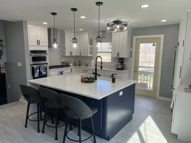 After: open kitchen with a navy island